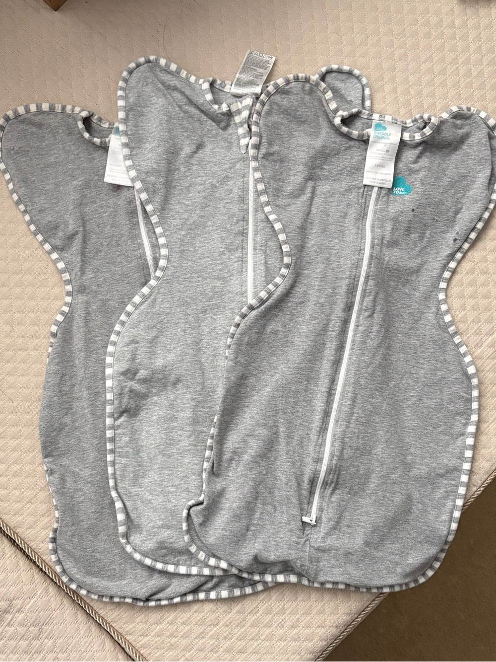 Three love to dream arms up swaddles size small
